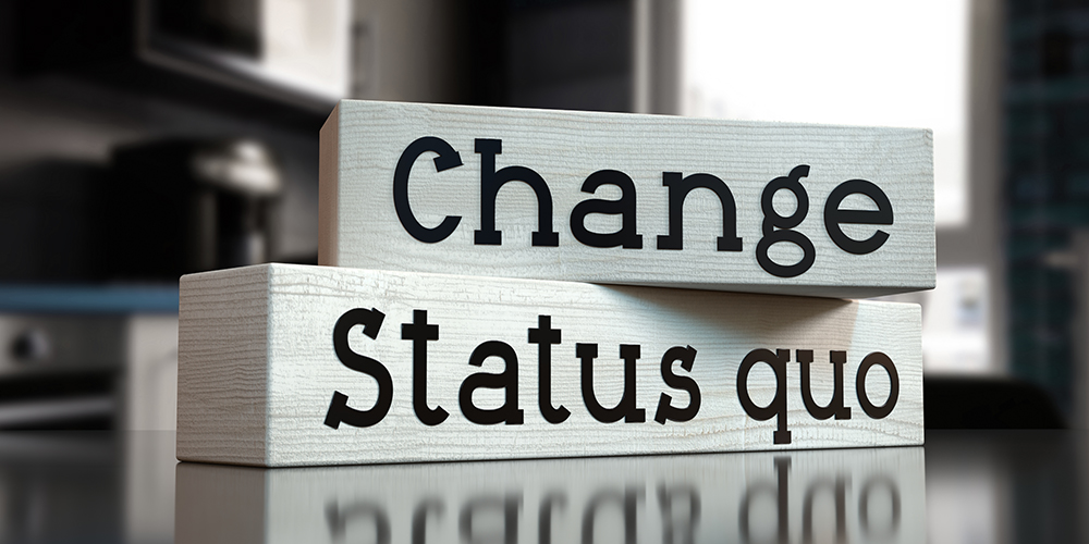 Status quo, change - words on wooden blocks 